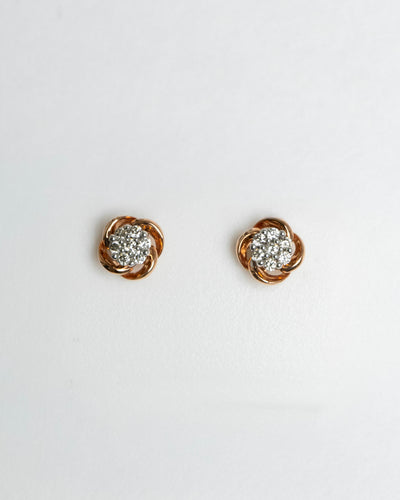 Arete para dama con diamante con montadura de 0.14Q en oro rosa de 14K